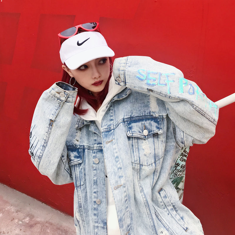 Graffiti painted old denim jacket coat