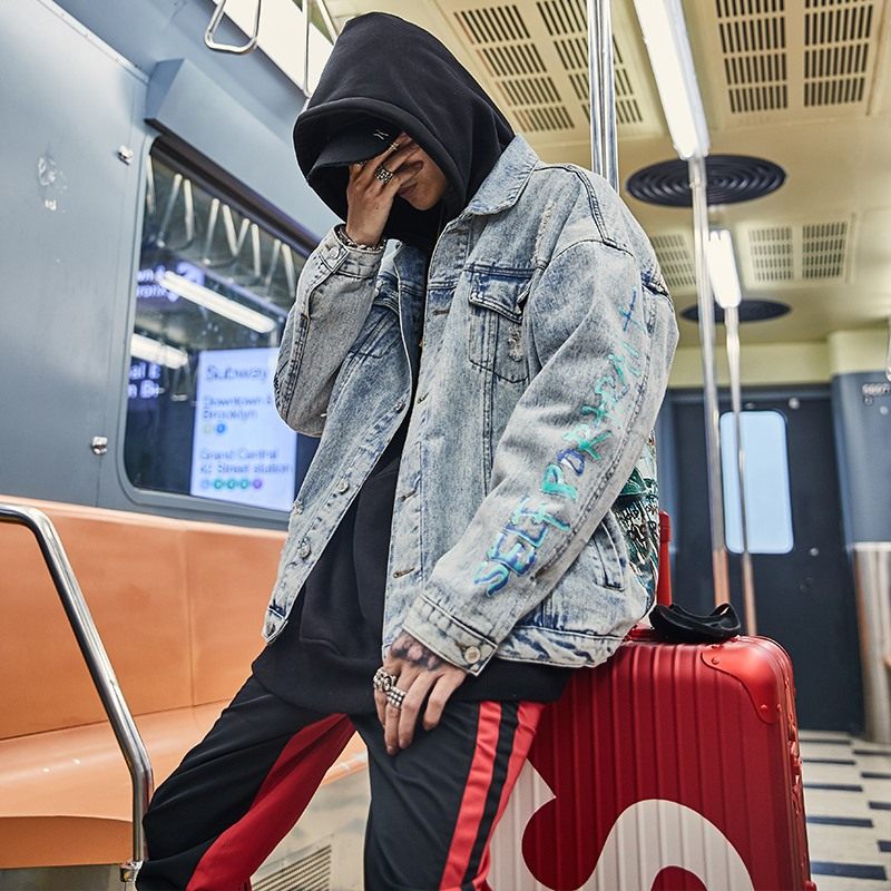 Graffiti painted old denim jacket coat